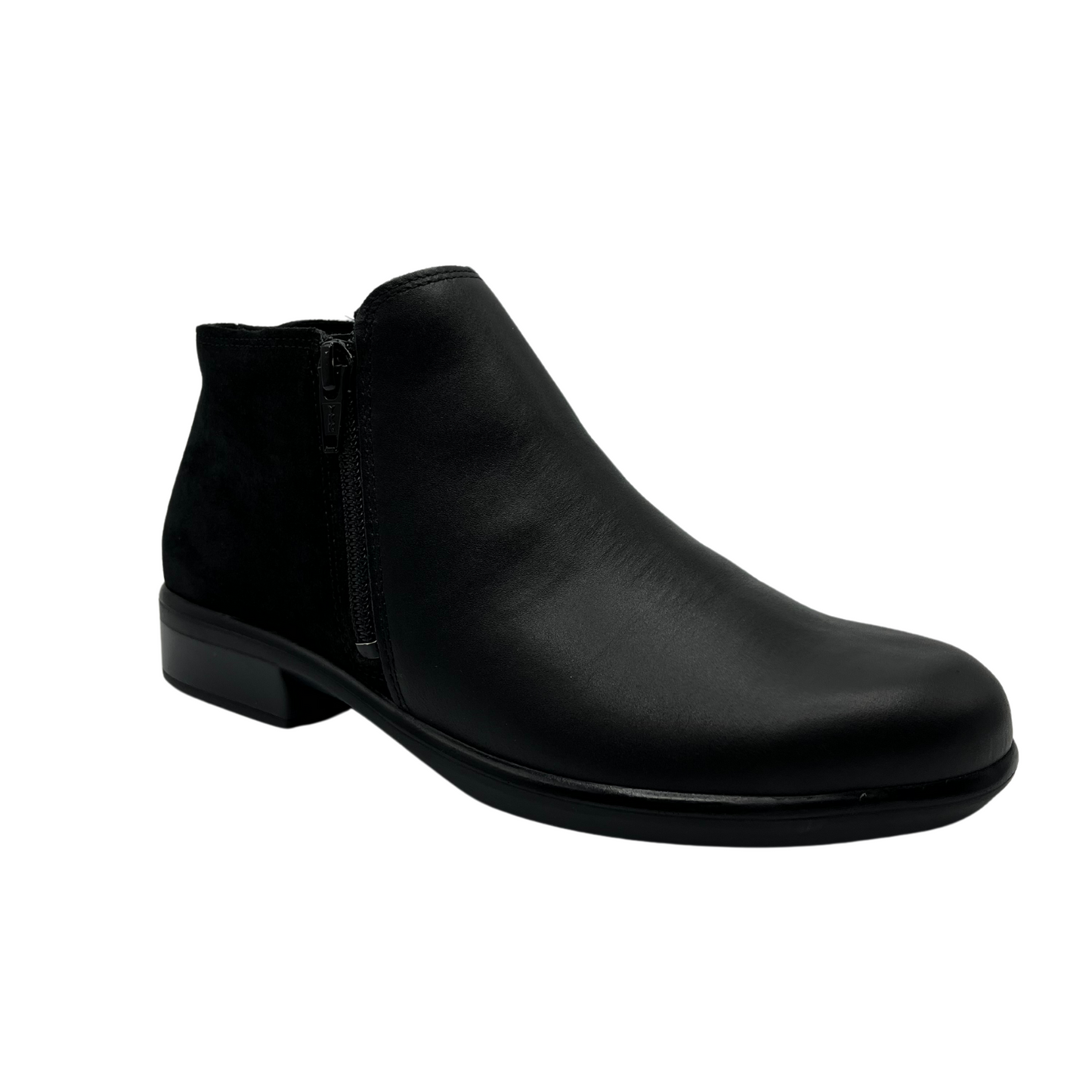 45 degree angled view of black leather short boot with black suede back half and double zipper closure