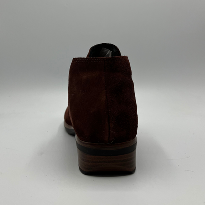 Brown suede shoe on a white background