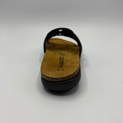 Black sandal with a tan insole on a white background