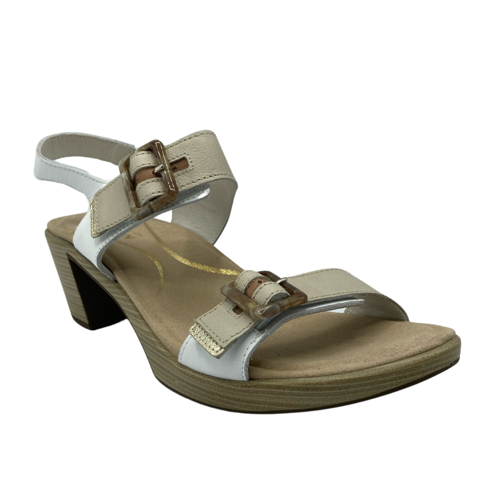 45 degree angled view of tan and white sandal with block heel and two buckle straps