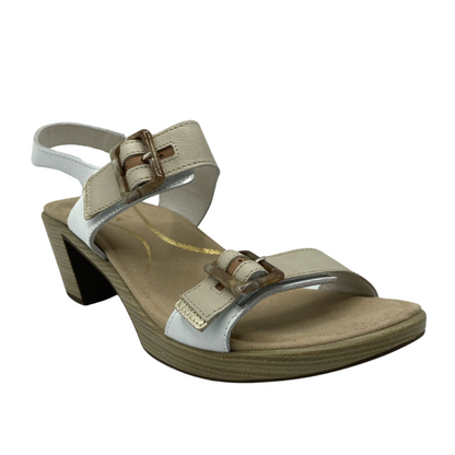 45 degree angled view of tan and white sandal with block heel and two buckle straps