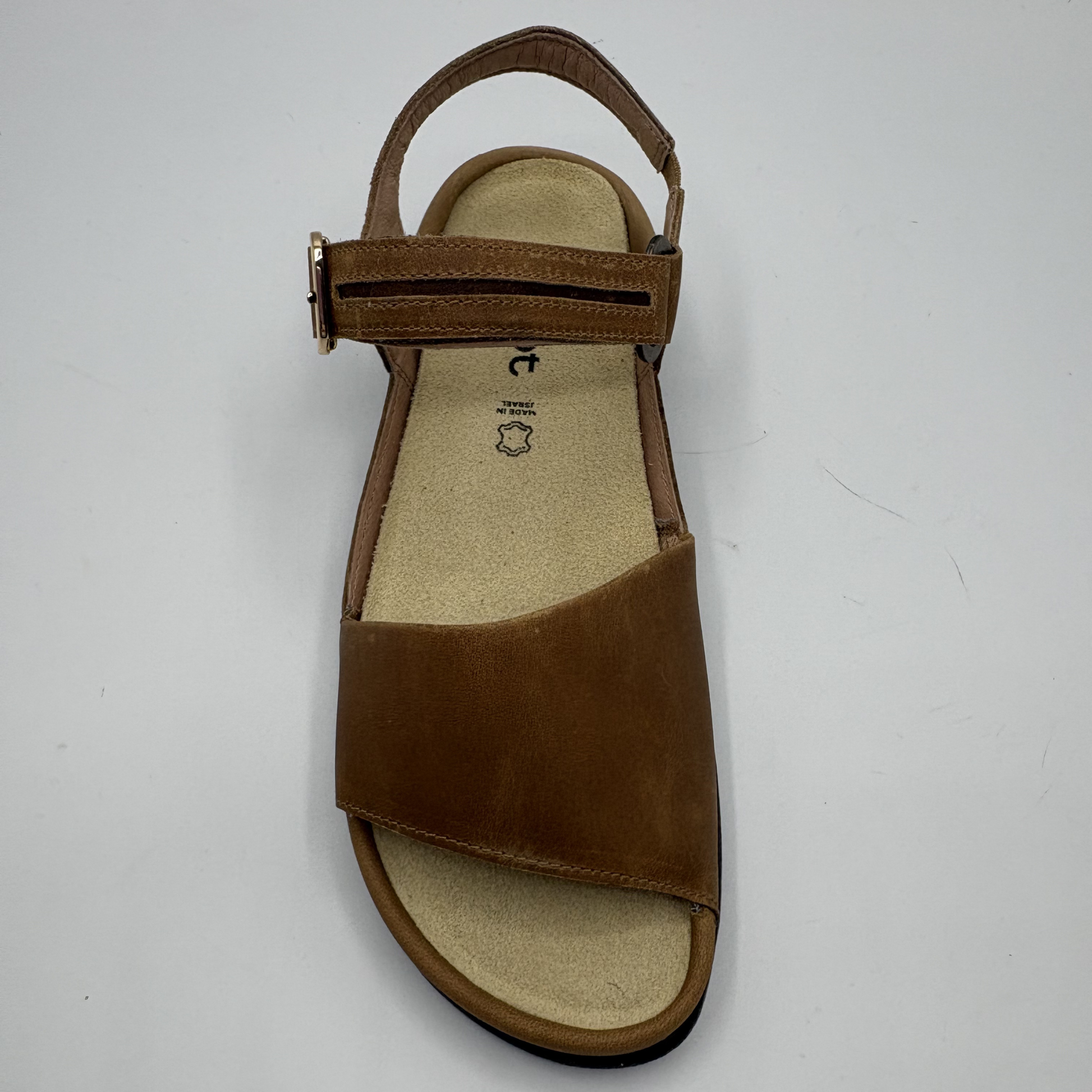 Top view of a brown adjustable strap sandal