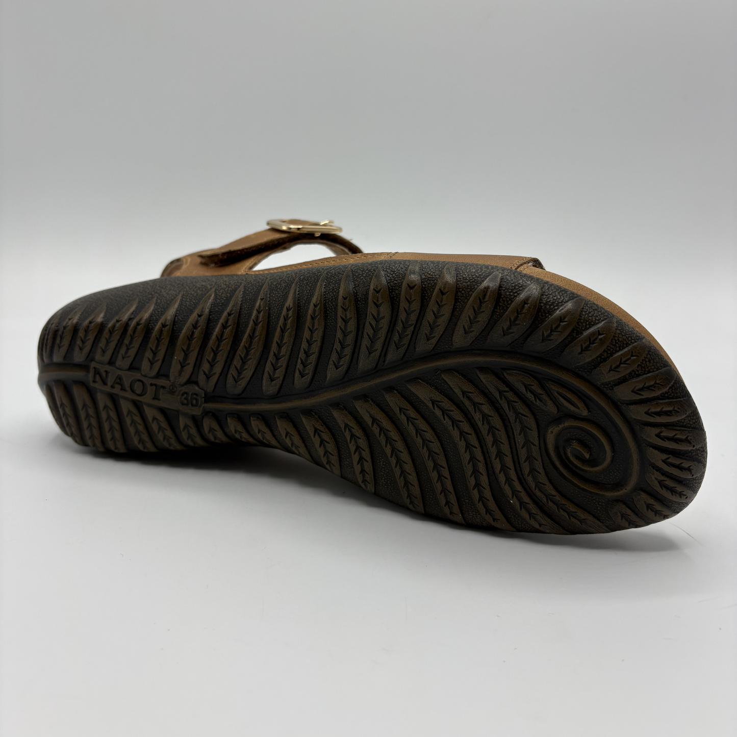 View of a brown adjustable strap sandal