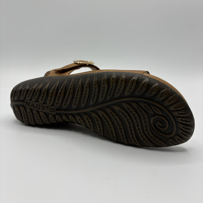 View of a brown adjustable strap sandal