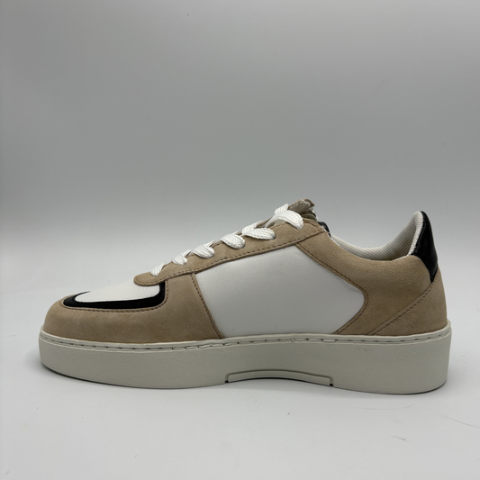 Left view of an almond, black and white sneaker with laces and a side zipper