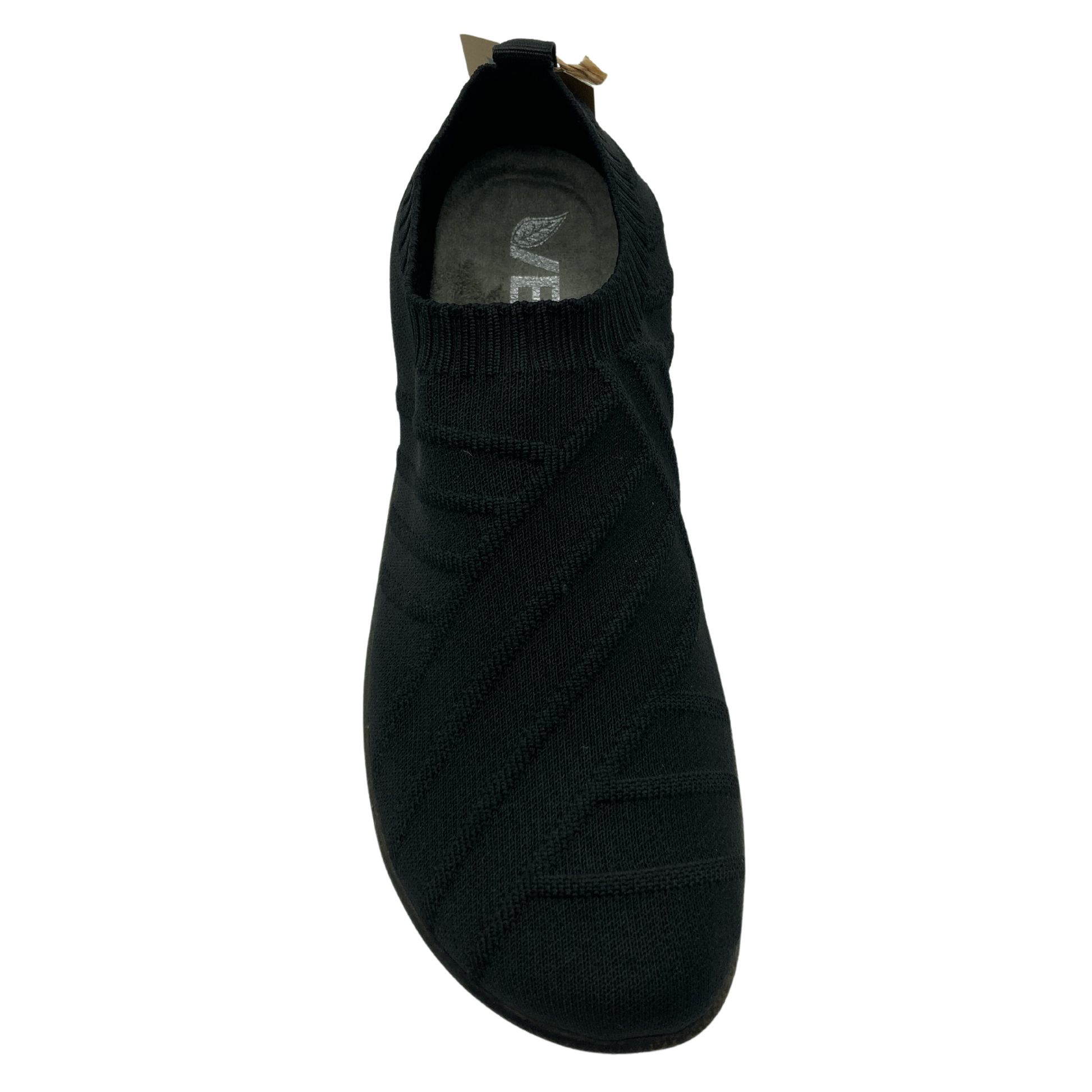 Top view of black knit textured sneaker with natural rounded toe and pull on heel tab