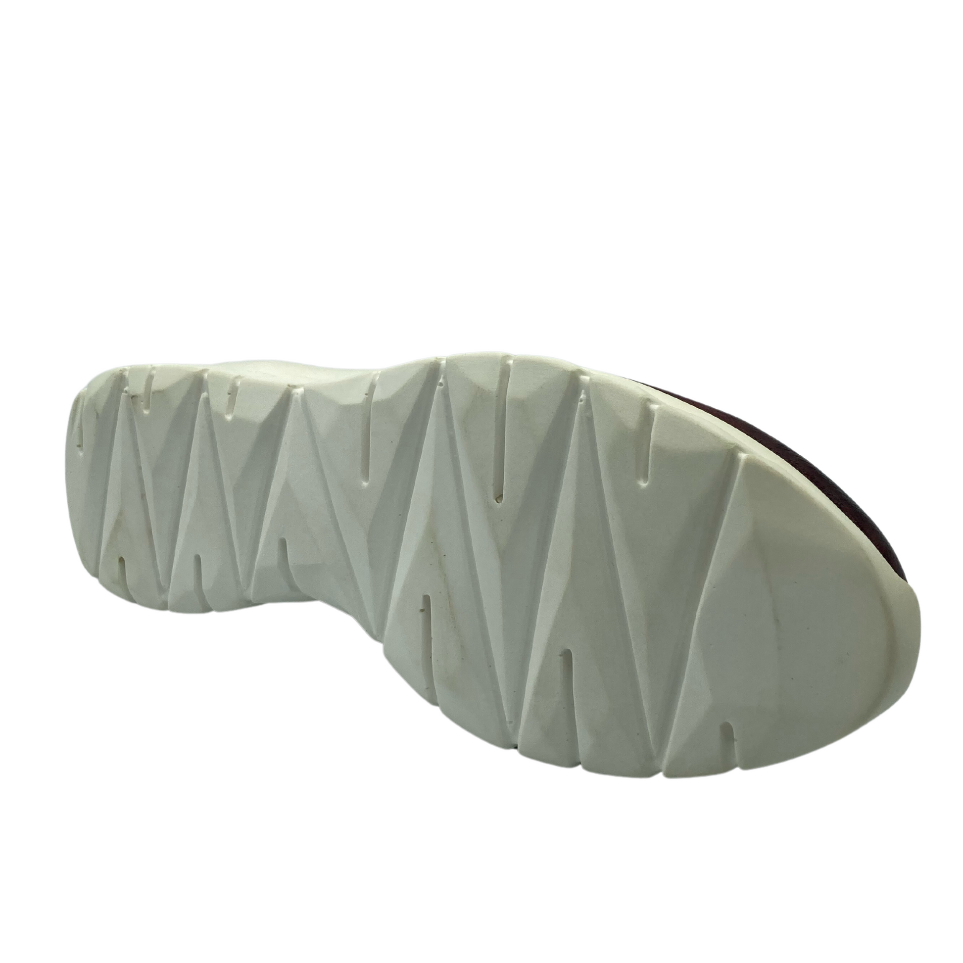 Bottom view of white, slip-resistant, sole of leather shoe