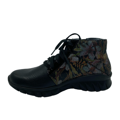 Left facing view of black and floral leather sneaker with black outsole and black laces
