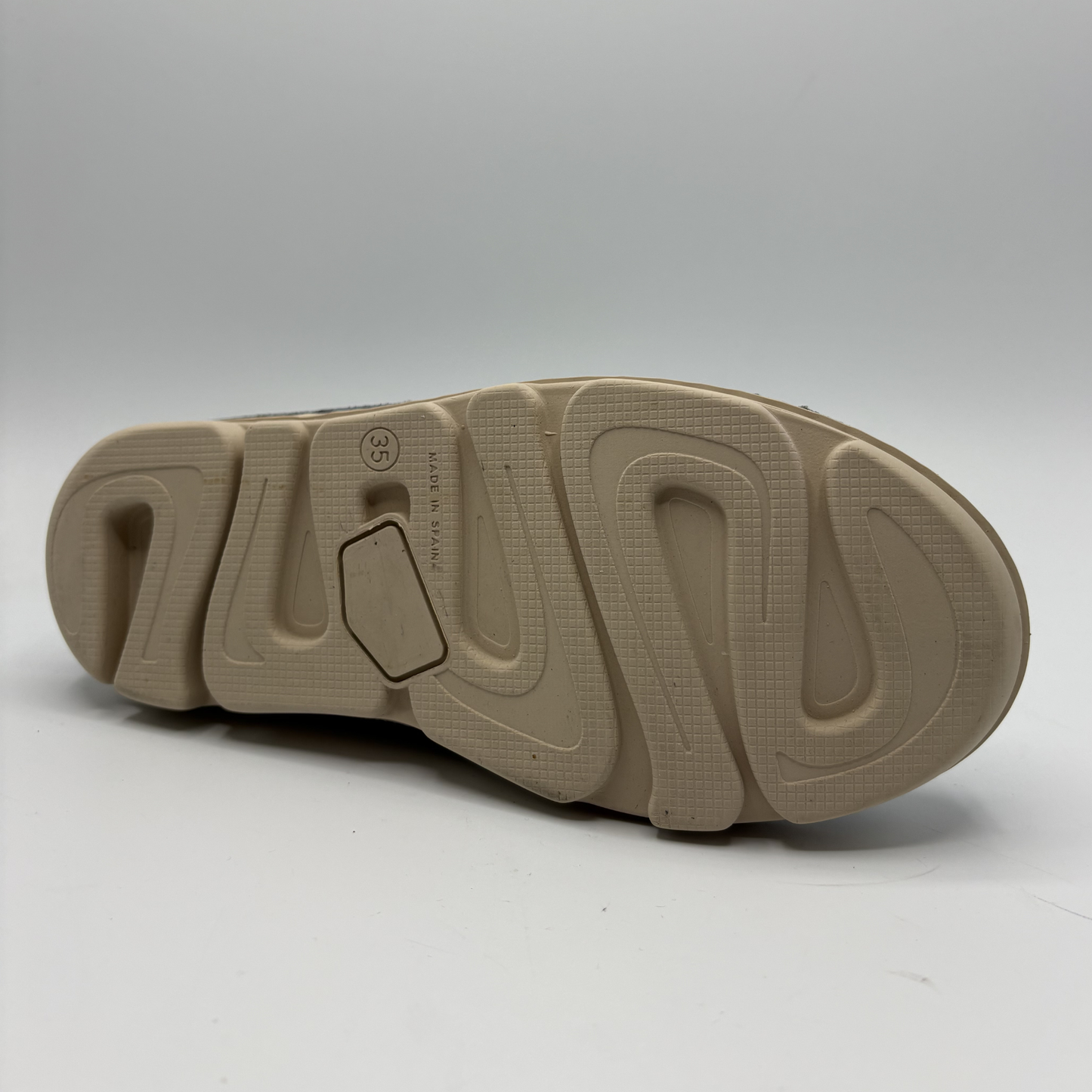 Beige shoe sole on a white background