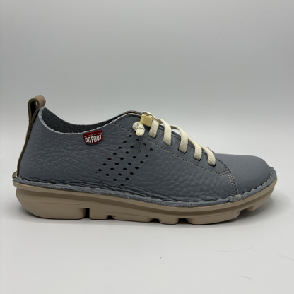 Gray sneaker with beige sole on a white background