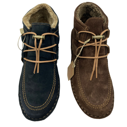 Top view of two short boots side by side. The one on the left is blue and the one on the right is brown. Both have tan stitching and tan cord laces with fur lining