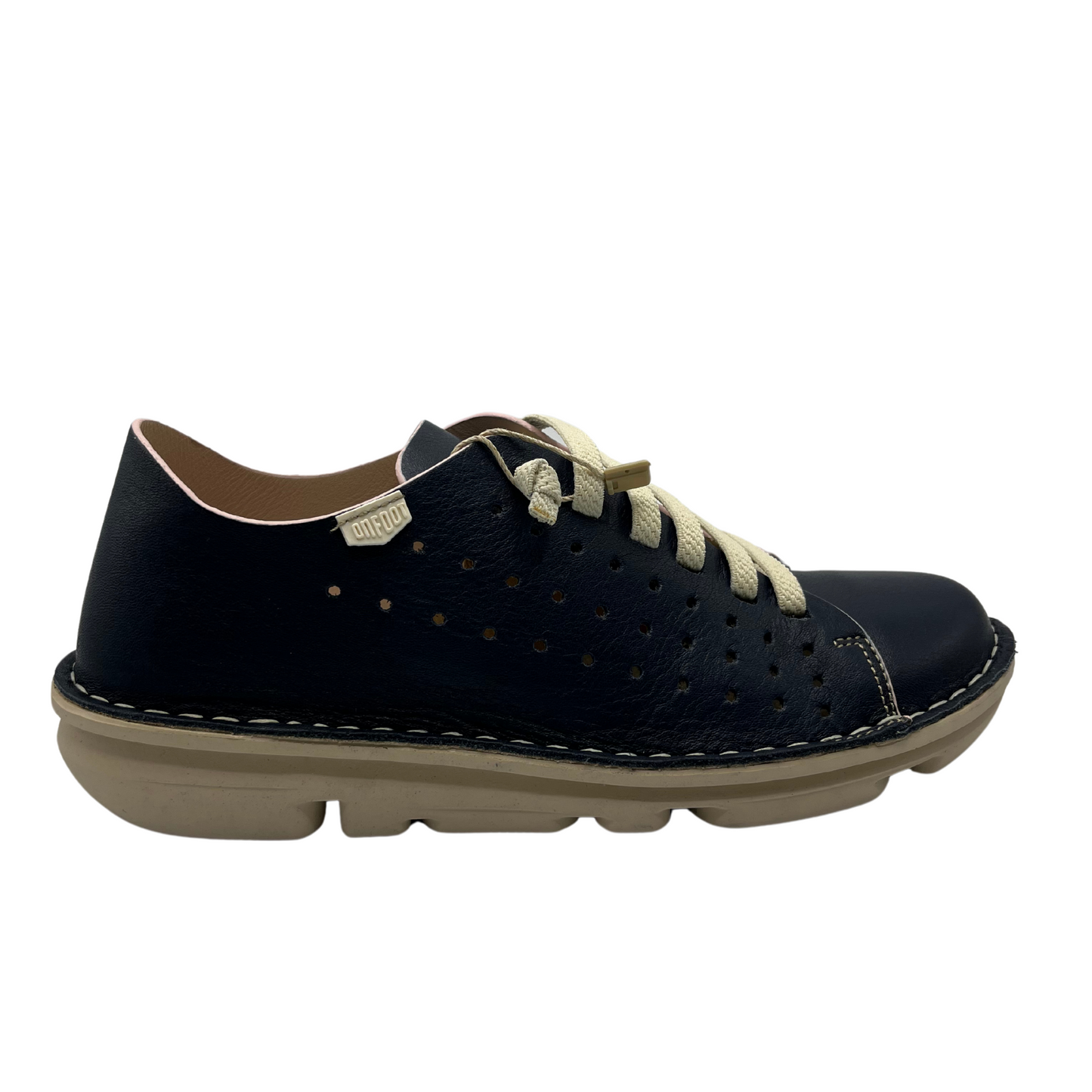 Right facing view of a navy perforated leather sneaker with cream laces and matching rubber outsole.
