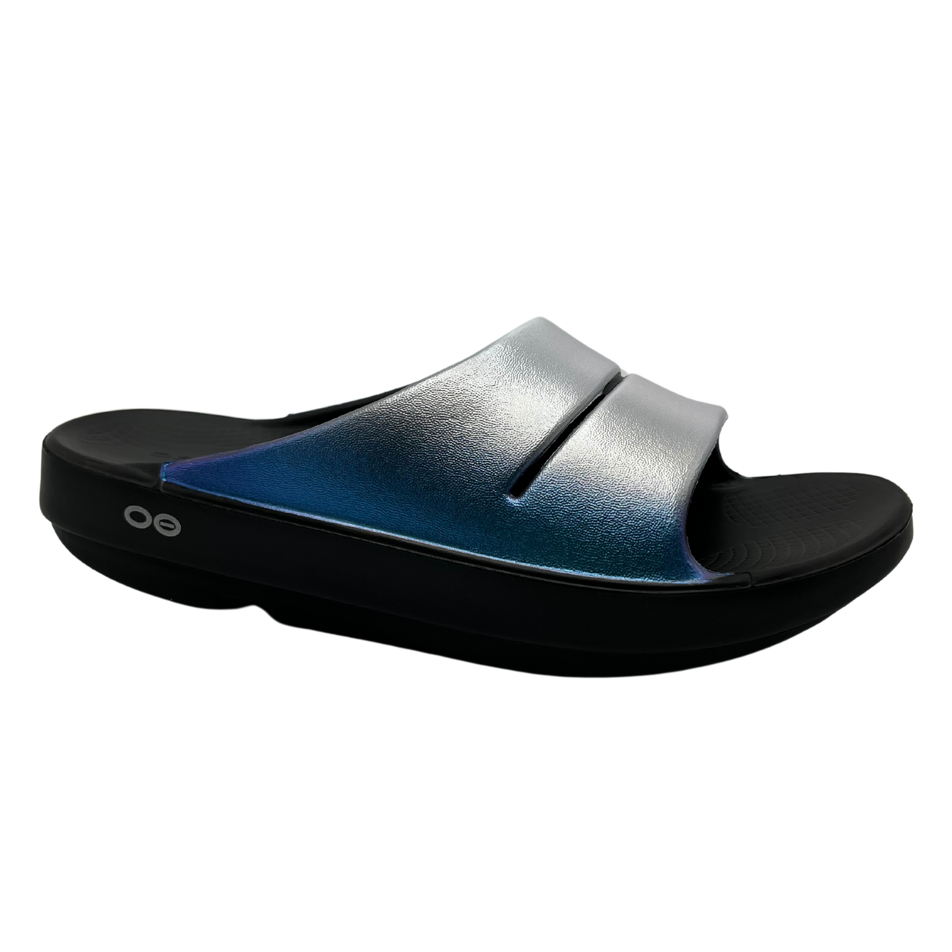 45 degree angled view of foam slip on sandal with frosty coloured iridescent straps and black outsole 