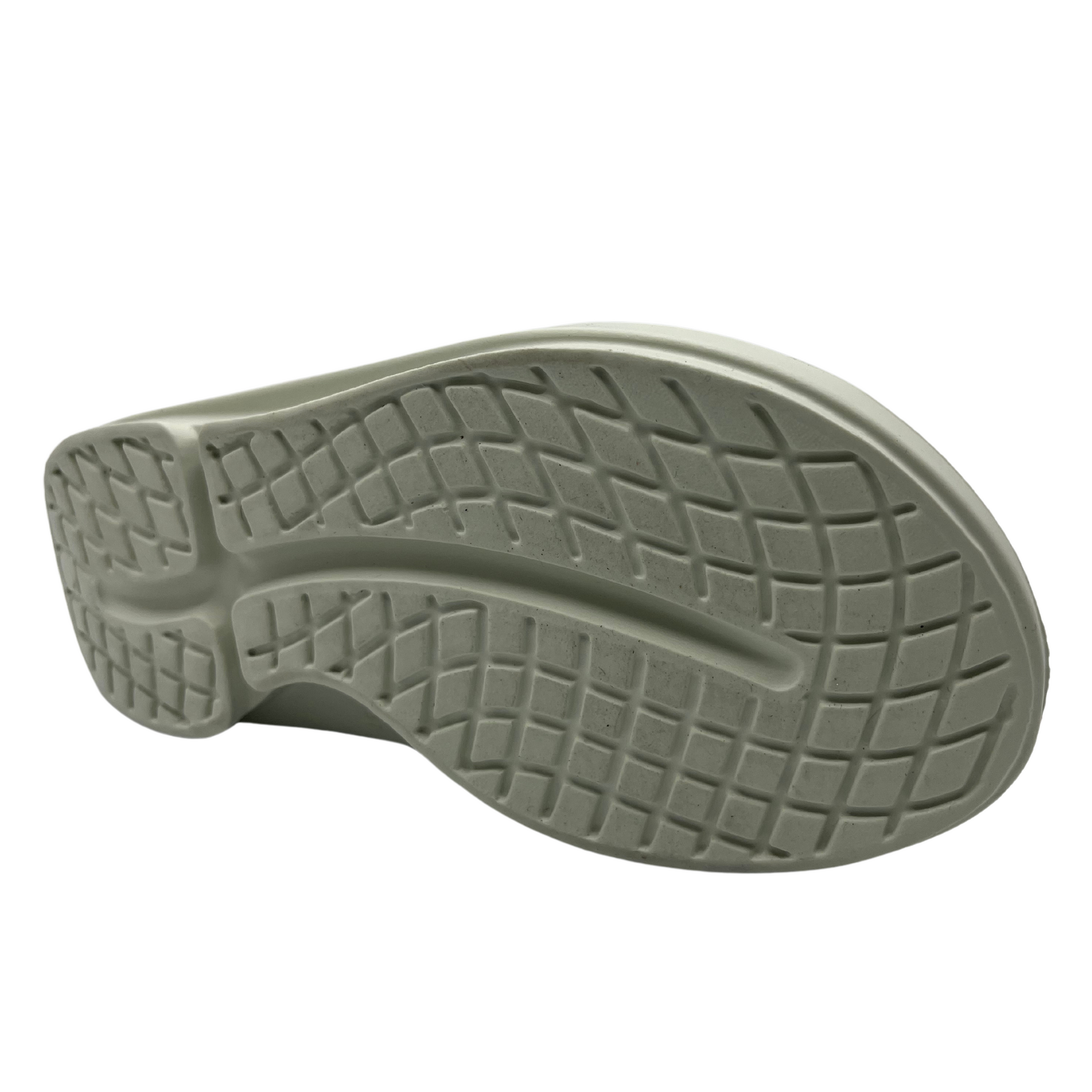 Bottom view of a grey foam slide with two over-foot straps and a grippy sole.