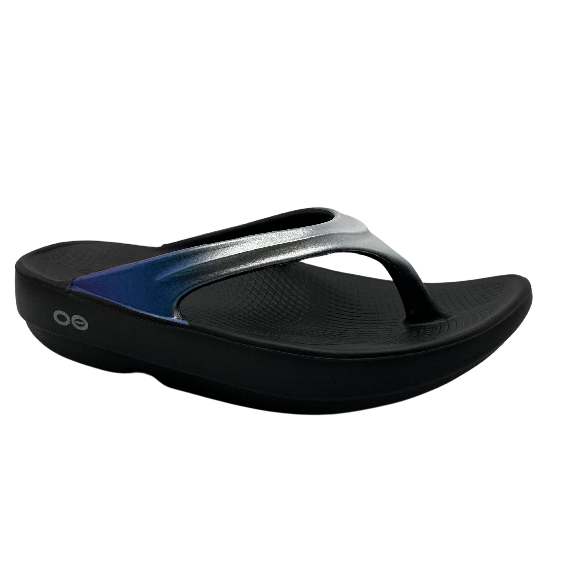 45 degree angled view of foam, thong strapped sandals with iridescent finish on straps 