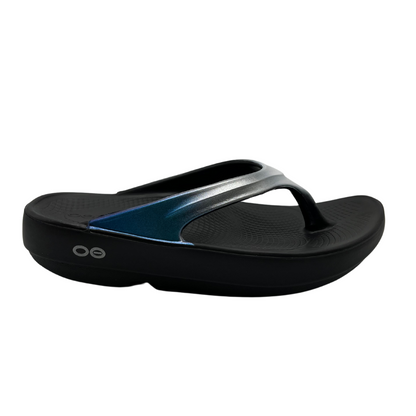 Right facing view of foam, thong strapped sandals with iridescent finish on straps