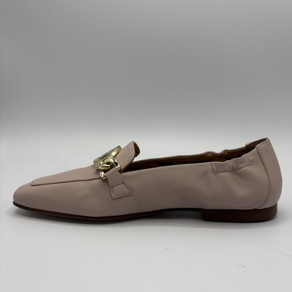 Left facing view of a leather loafer with a gold accent