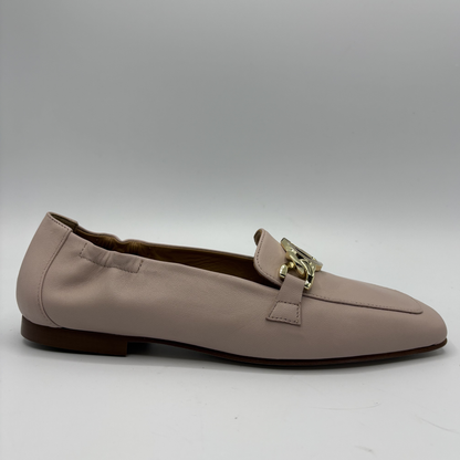 Right facing view of a leather loafer with a gold accent