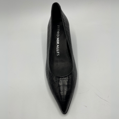 Black pointed-toe shoe with 'Pedro Miralles' branding on a light gray background