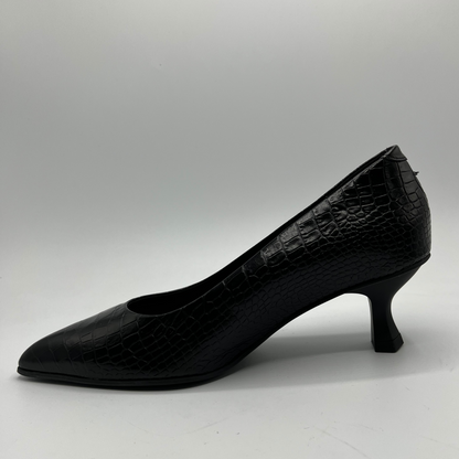 Black high-heeled shoe with a textured surface on a white background