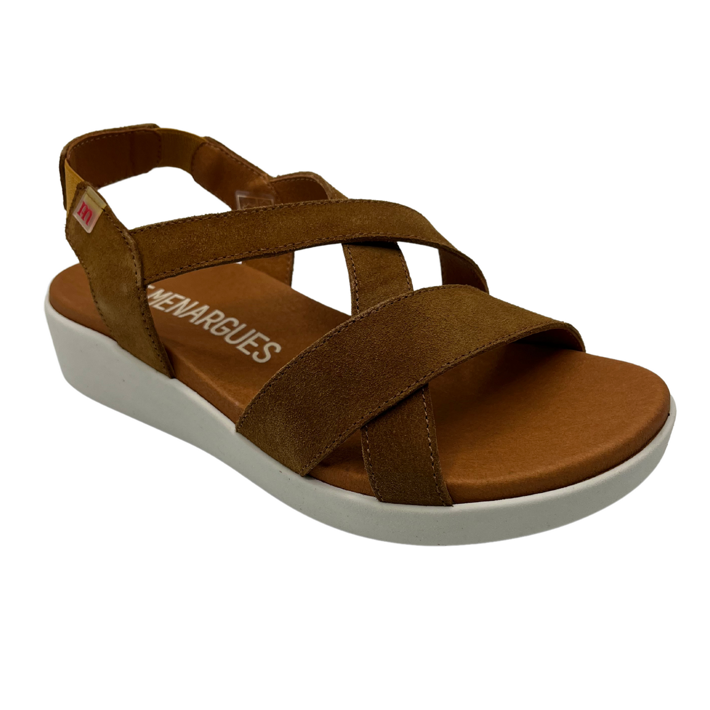 45 degree angled view of brown suede sandals with white rubber outsole