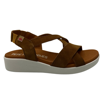 Right facing view of brown suede sandal with elastic slingback strap and white rubber outsole