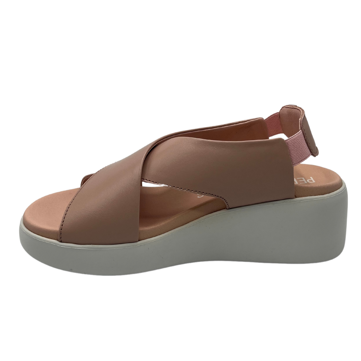 Left facing view of leather crisscross strap sandal with white wedge heel 