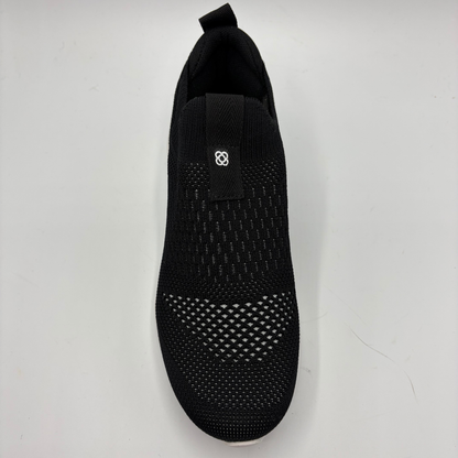 Black sock shoe on a light gray background