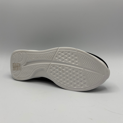White sole of a shoe on a gray background