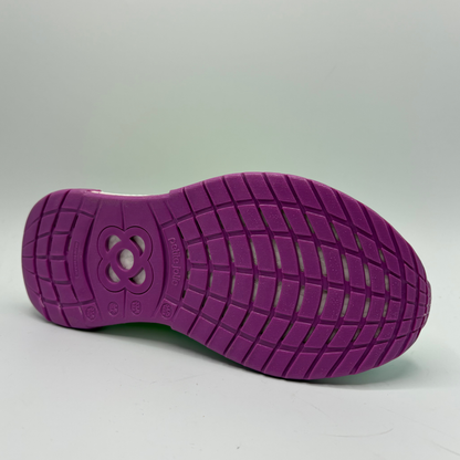 Purple shoe sole with textured pattern on a gray background