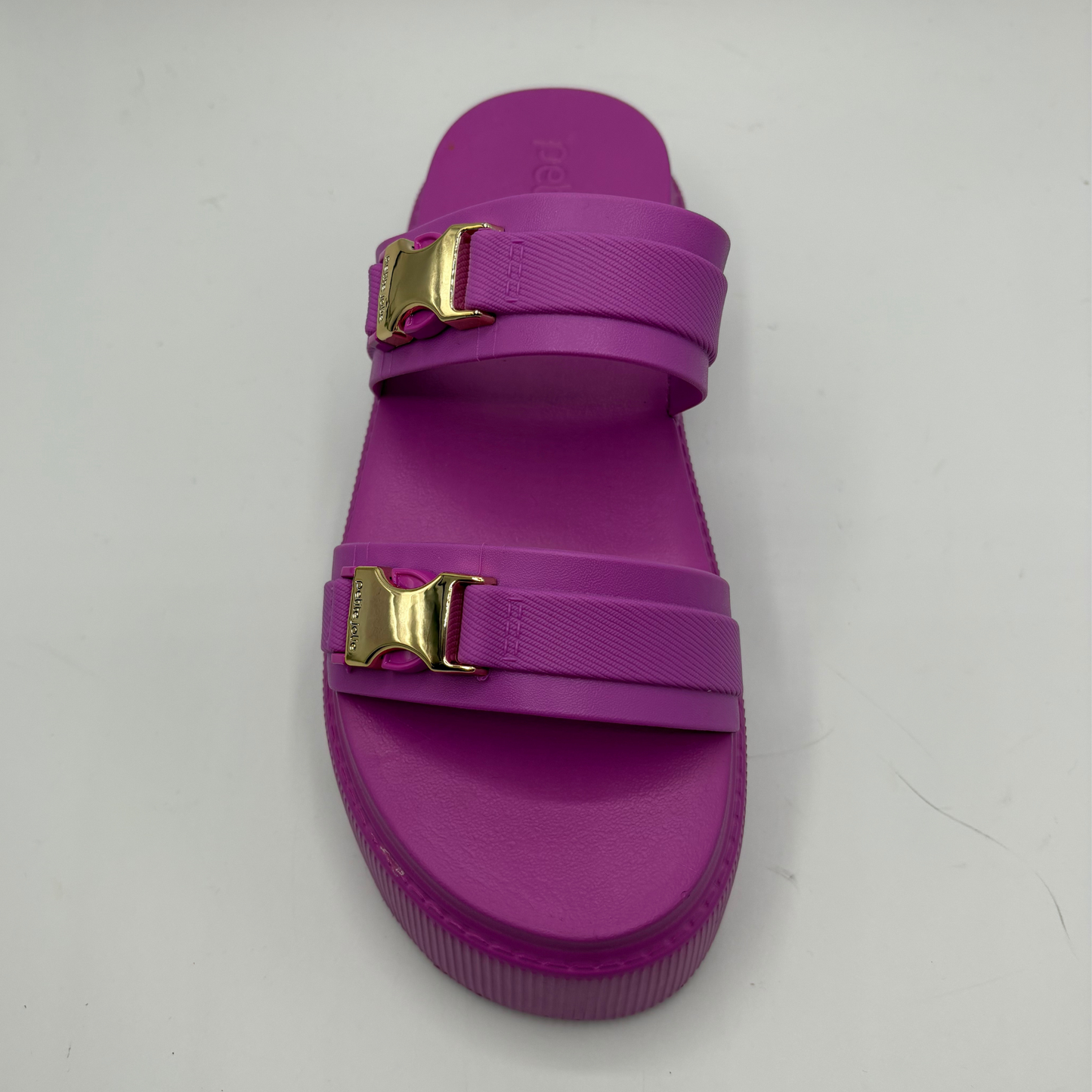 Purple sandal with gold buckles on a white background