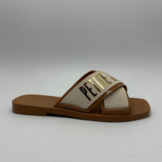 Brown sandal with a beige strap featuring text on a gray background