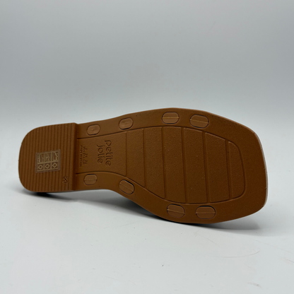 Brown sandal sole with brand name on a white background