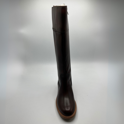 Brown knee-high boot on a light gray background