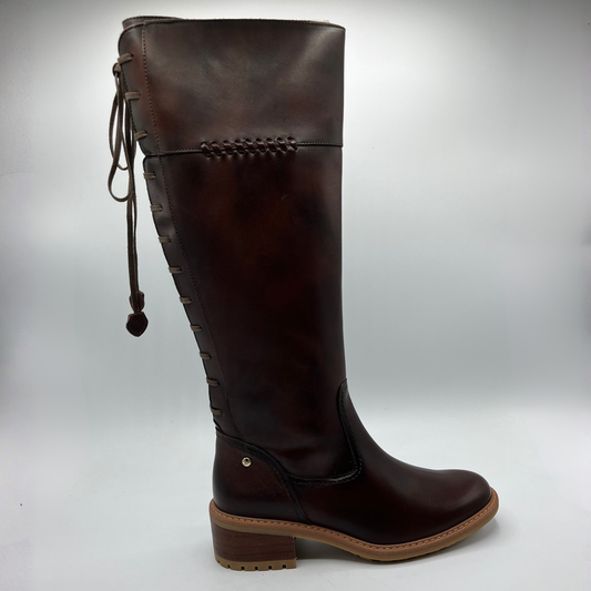 Brown knee-high boot on a white background