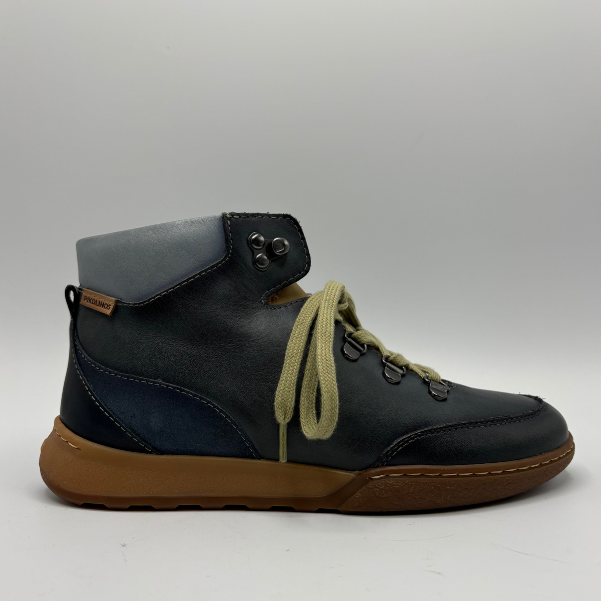 Right facing view of a leather short boot with a lace up closure