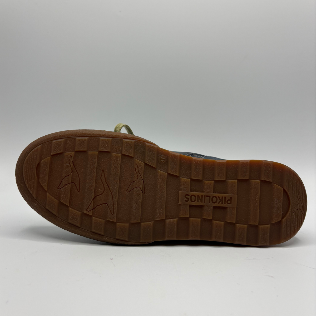 Bottom  view of a leather short boot with a lace up front and a side zipper closure