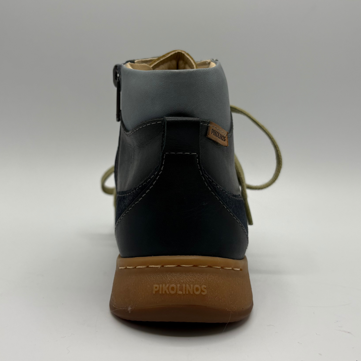 Back  view of a leather short boot with a lace up front and a side zipper closure