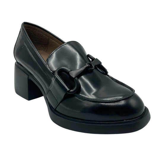 Angled view of black glossy leather heeled loafer with bit ornament 