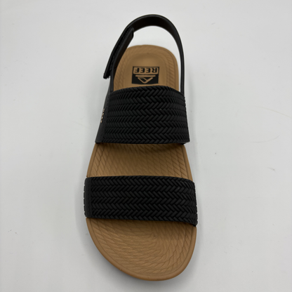Top view of a black and tan braided strap sandals
