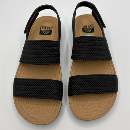Top view of black and tan braided strap sandals