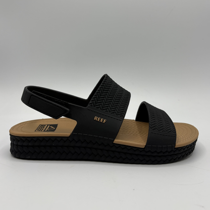 Right facing view of black and tan braided strap sandals