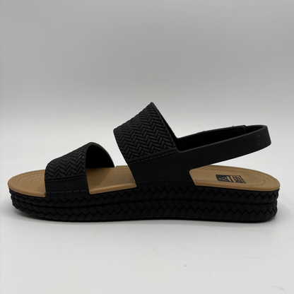 Left facing view of a black and tan braided strap sandals