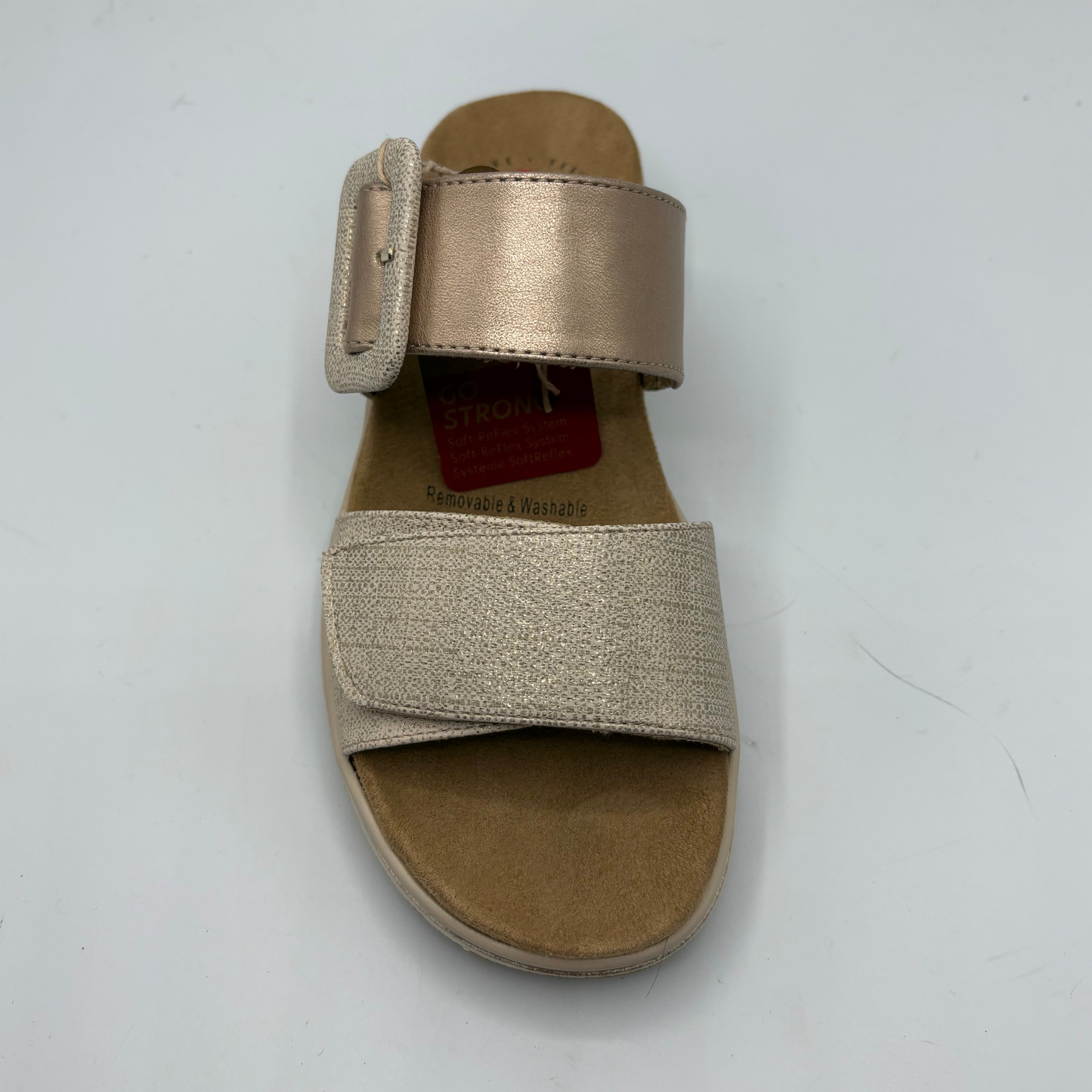 Gold sandal with a strap on a white background