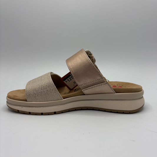 Beige sandal with a platform sole on a white background