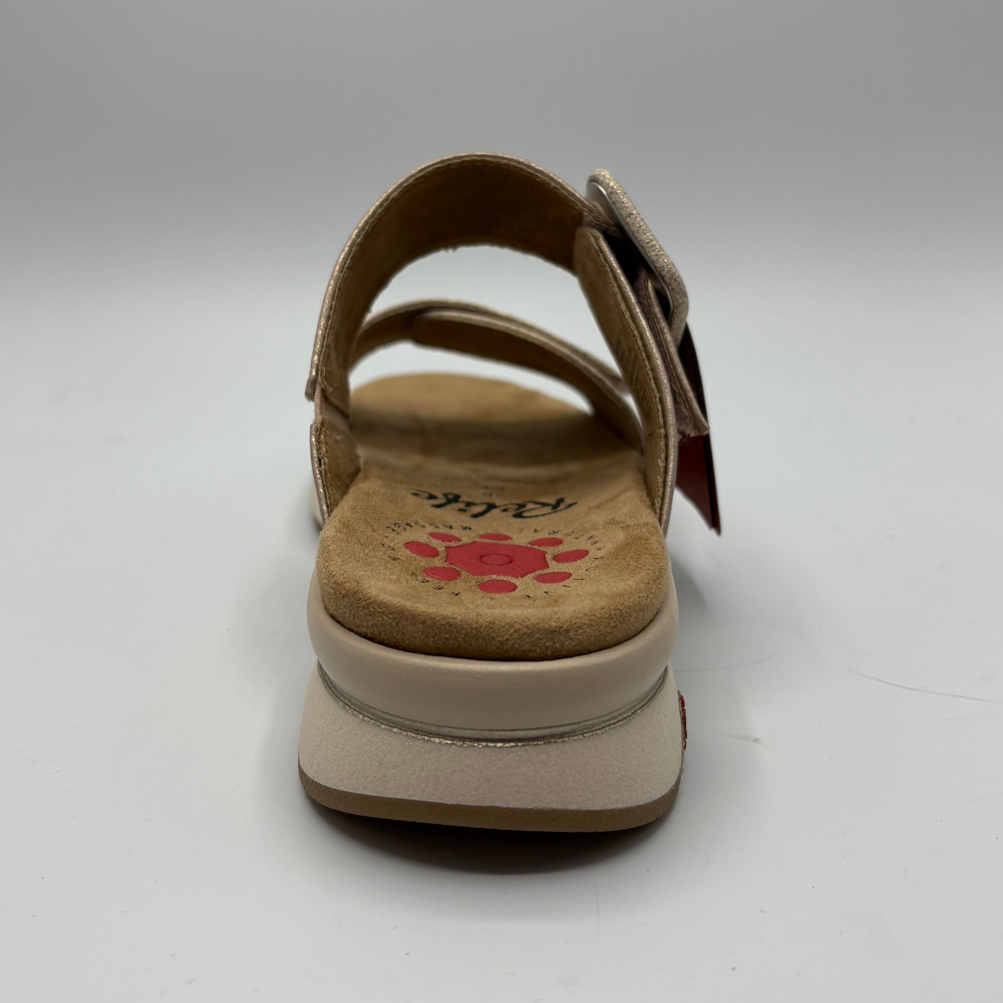 Beige sandal with a visible brand logo on a white background