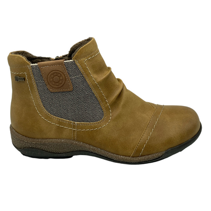 Right facing view of mustard short boot with grey elastic side, rounded toe and rubber outsole