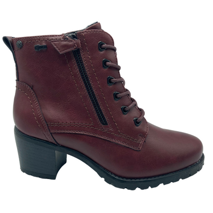 Right facing view of maroon bootie with black block heel and side zipper closure