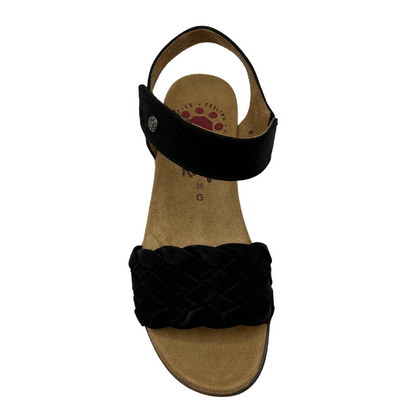 Top view of black strapped sandal with lattice design on toe and velcro ankle strap