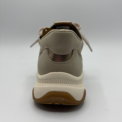 Beige sneaker with a white sole on a gray background